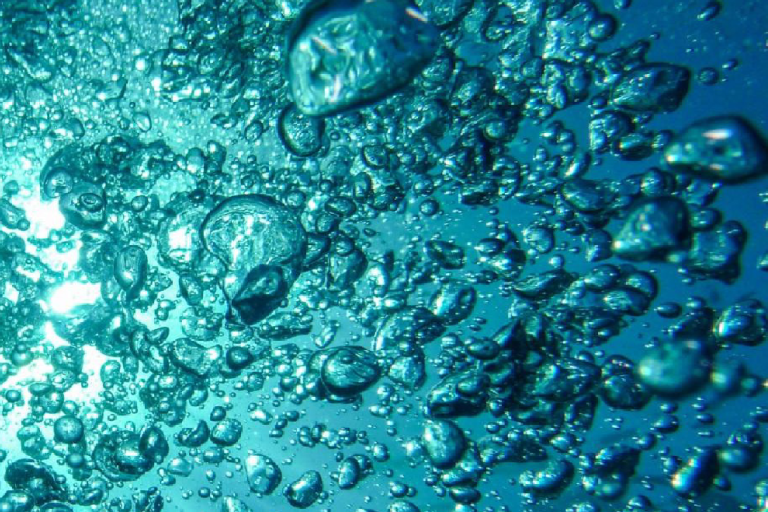 Underwater view of bubbles with the text "Oxygen Essential Climate Variable (ECV) Factsheet" and logos of related organizations on the left side.